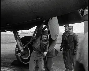 Liberator: American Ground Crew Lifting Airman Out Of