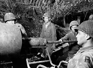 155mm: American gunners load a shell into the barrel