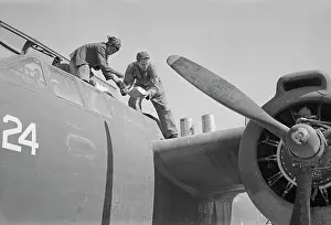 Warplane: An American plane mechanic assisted by an