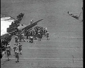 Crowding: American Sailors Crowding Around a Crashed