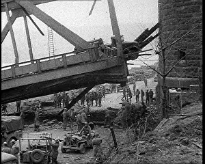 Collapsing: American Soldiers and Vehicles Around A Collapsing