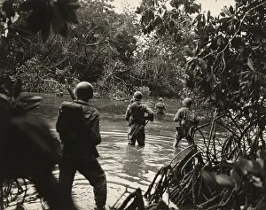 Cartwheel: American soldiers wading through water in ?