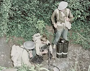Rounds: American troops set up a small trench mortar