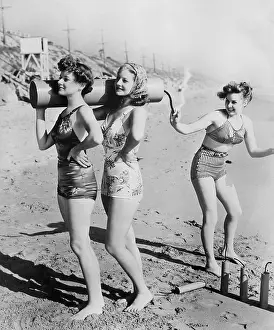 Sometimes: American women on a beach with a large firework