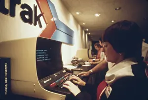 Terminals: An AMTRAK worker at a computer terminal ?