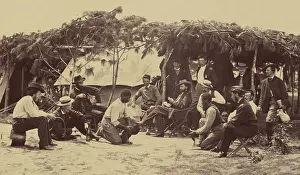 Cockfight: To the amusement of Union soldiers, two ?