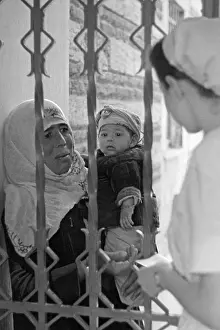 Clinic: Anatolian peasant with her child in front of