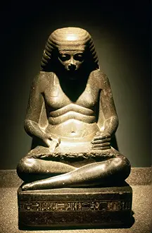 Scribe: Ancient Egyptian scribe, seated. Granite statue