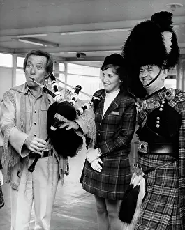 Bladder: Andy Williams, American singer, with bagpipes