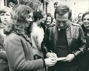 Claudine: Andy Williams, popular singer, signing an autograph