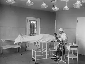 Sedation: Anesthesiologist administers ether and nitrous oxide