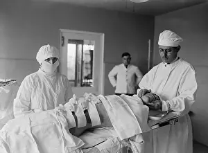 4 People: Anesthesiologist and surgical nurse with a post-operative
