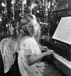 Feste: Angel playing the piano