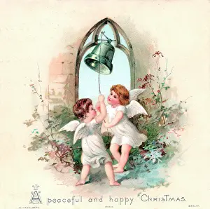 Cherubic: Two angels ringing a bell on a Christmas card