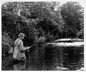 Wades: ANGLER CASTS HIS LINE