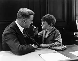 Intent: Angry boy pointing at father