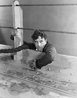 Glare: Angry man climbing aboard boat