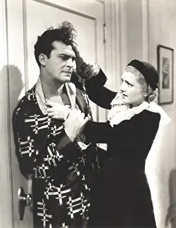 Wrists: Angry woman pulling man's hair
