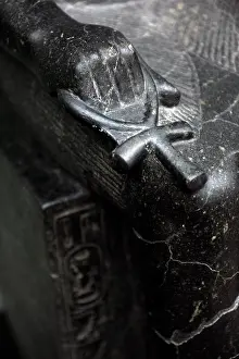 Barefooted: Detail of the Ankh at the statue of egyptian God Anubis