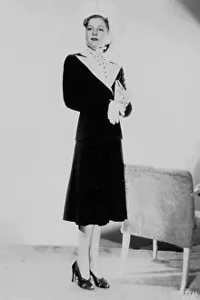 Chaser: Ann Morriss wearing a smart suit designed by Dolly Tree