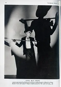 Reproductions: Anna May Wong, actress, studio portrait with top hat, cane