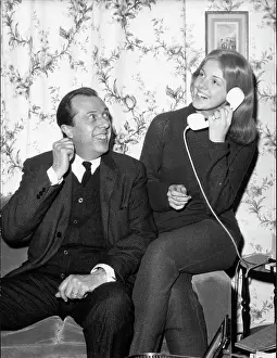 Duperey: Anny Duperey sitting on the sofa on the telephone