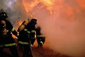 Consumed: Anonymous Firemen Rushing Into Flames and Thick Smoke