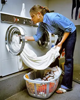 Homemakers: Anonymous Housewife Unloading Finished Laundry