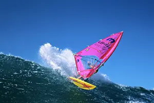Surfer: Anonymous Man Wind Surfing on Yellow Boards