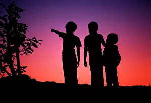 Lga001: Three Anonymous Silhouetted Boys Standing Together