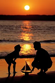 Laf002: Anonymous Silhouetted Father and Son at the Beach with To