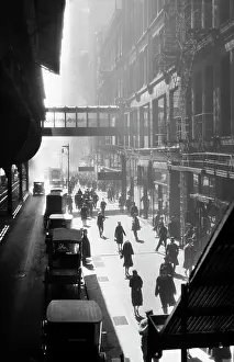 Gotham: Anonymous Silhouetted Pedestrians Walking on Sidewalk
