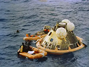 Reentry: Apollo 11 Recovery. Behind the floating ?
