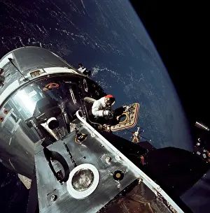 Capsules: Apollo 9 astronaut Dave Scott stands in ?