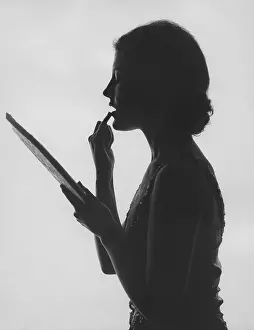 Balm: Applying makeup in silouette