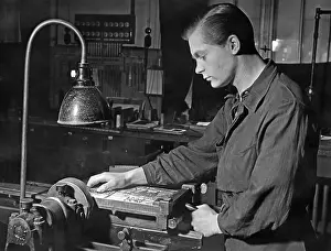 Apprentice: Apprentice at an edge processing machine, 1941