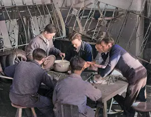 Andcolourisedpic: Apprentices mix and heat glue for use in glider repairs