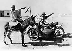 Motorcyclist: Arab with a German soldier, 1942