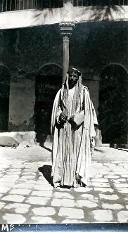 Sepia Images: Arab man in a courtyard, Middle East
