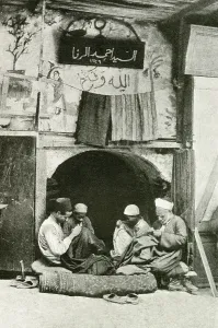 Tailors: Arab tailor and assistants at work in a shop, Cairo, Egypt