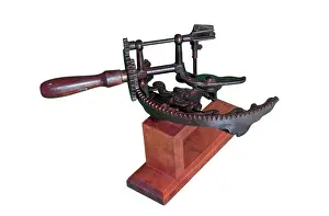 Industrialisation: Arc apple peeler with a wooden base