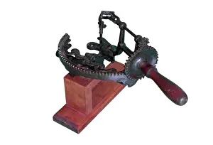 Industrialisation: Arc apple peeler with a wooden base