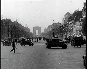 Elysees: The Arc de Triomphe with Cars Driving Along