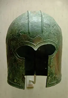 Corinthian: Archaic bronze helmet. Corinthian type. 700-675 B.C. Greece
