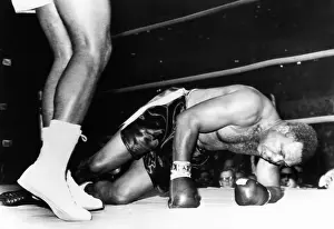 Spelled: Archie Moore on the canvas in the fourth round