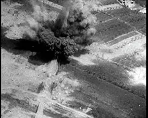 Ariel: An Ariel View of a Road Being Bombed