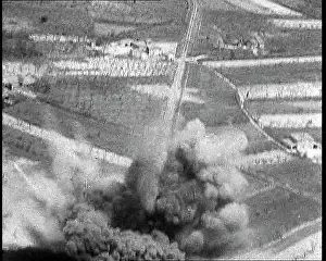 Ariel: An Ariel View of a Road Being Bombed