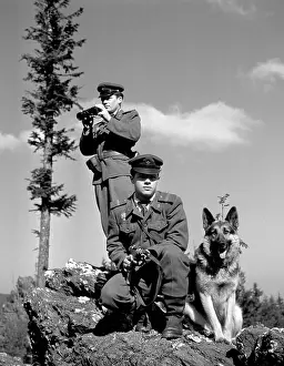 Escapees: Armed border patrol with dog