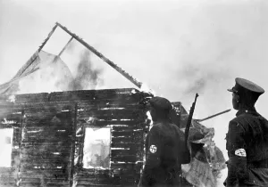 Armbands: Armed Lithuanian in front of a burning synagogue, 1941