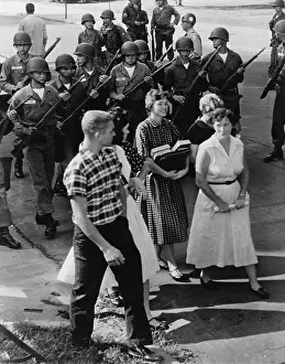 Disperse: Armed National Guardsmen disperse a group ?